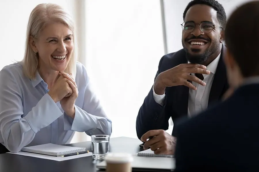 Diverse business leaders happily talking